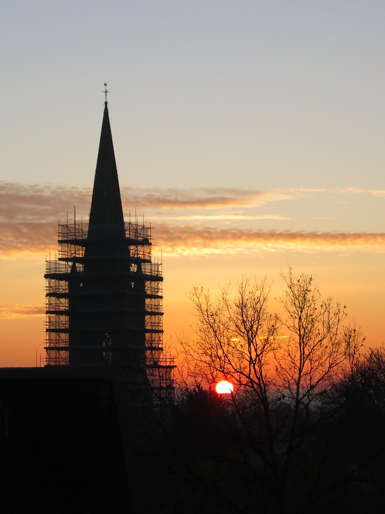 Scaffolded tower at sunset